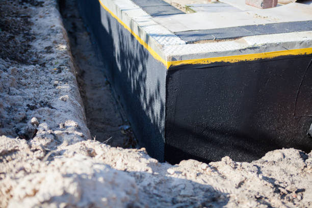 Professional Waterproofing technician working in Rock Island, IL